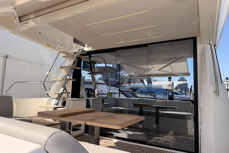 Slide: The Image of Luxurious 2023 Prestige 520 yacht interior with modern seating and sleek design. - 4