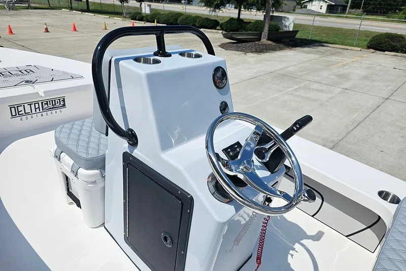 Slide: The Image of 2025 Delta Boatworks Delta D18 helm with steering wheel and controls. - 14