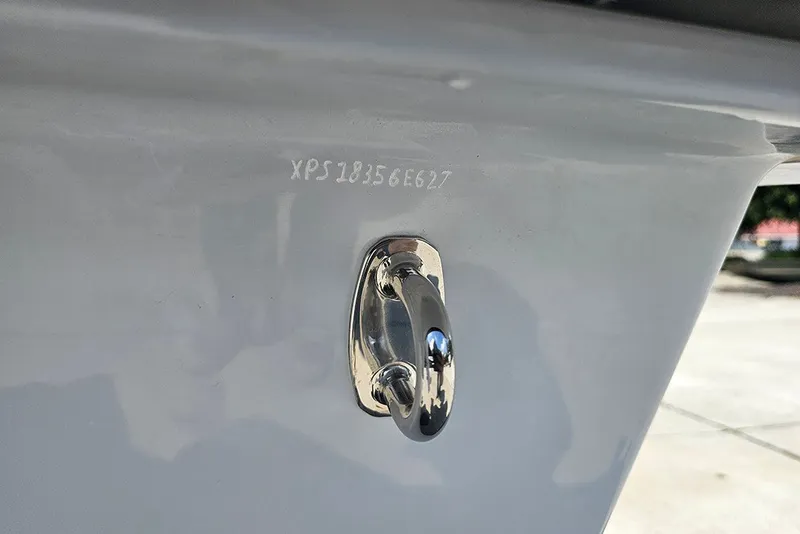 Slide: The Image of 2025 Delta Boatworks Delta D18 hull with serial number and metal fitting detail. - 22