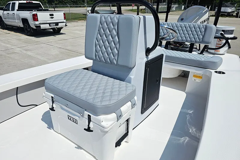 Slide: The Image of 2025 Delta Boatworks Delta D18 with cushioned seating and Yeti cooler on deck. - 16