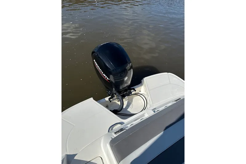 Slide: The Image of 2023 Bayliner VR6 Bowrider OB with Mercury outboard motor on calm water. - 12