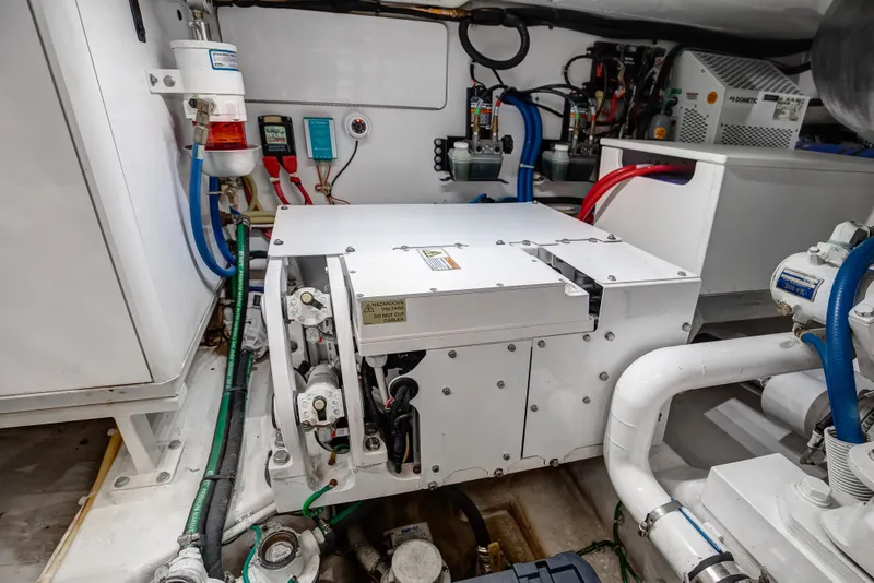 Slide: The Image of Engine room of 2021 Viking 46 Billfish yacht, showcasing mechanical and electrical systems. - 20