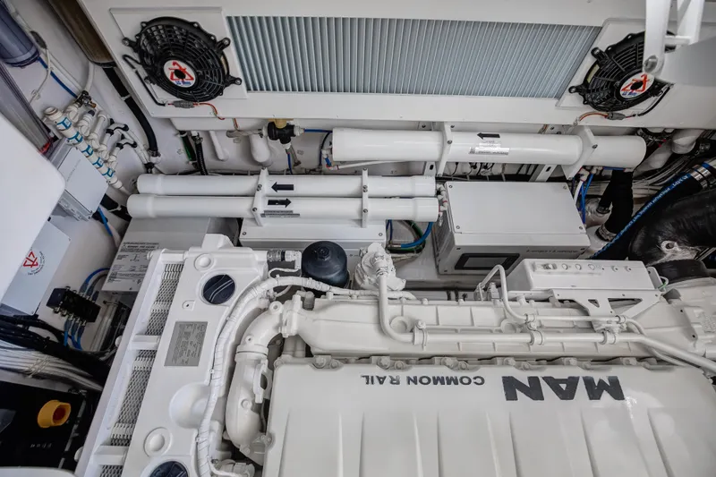 Slide: The Image of Engine room of 2021 Viking 46 Billfish yacht, featuring MAN diesel engine components. - 22