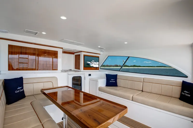 Slide: The Image of Luxurious interior of 2021 Viking 46 Billfish yacht with elegant seating and scenic window view. - 16