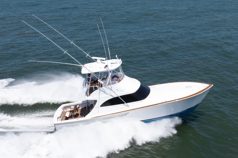 Slide: The Image of 2021 Viking 46 Billfish yacht cruising swiftly on open water. - 25