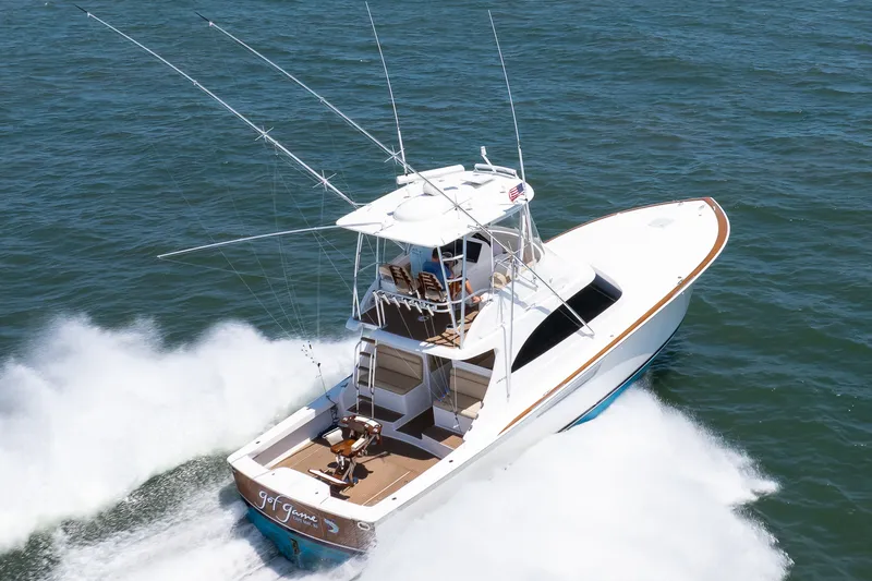 Slide: The Image of 2021 Viking 46 Billfish yacht cruising on open water, aerial view. - 24