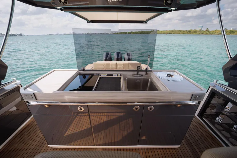 Slide: The Image of Luxury Hanover 447 yacht kitchen with sleek design, overlooking serene blue waters, 2026 model. - 35