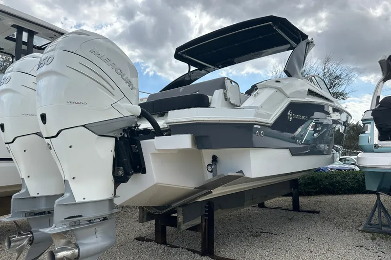 Slide: The Image of 2019 Cruisers Yachts 338 Outboard with dual Mercury engines, displayed outdoors. - 34