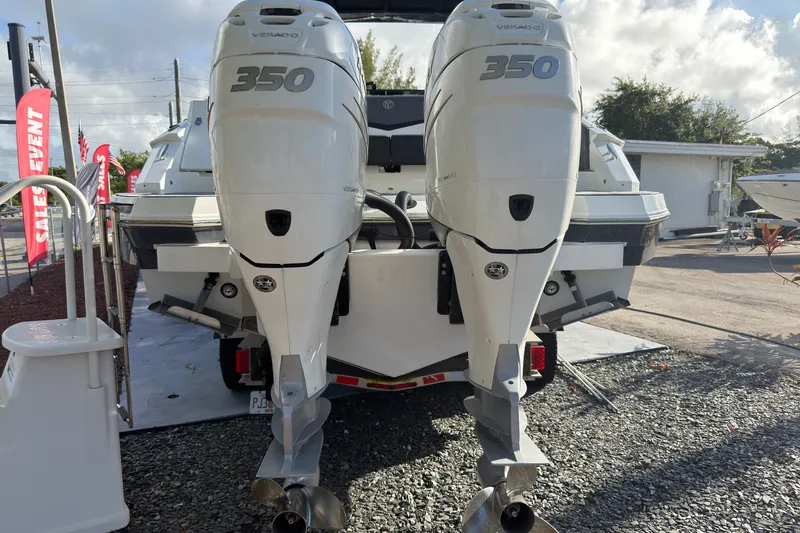 Slide: The Image of 2019 Cruisers Yachts 338 Outboard with twin 350 Verado engines, displayed outdoors. - 33