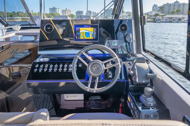 Slide: The Image of Helm of 2026 Hanover 347 boat with advanced navigation system and controls. - 19