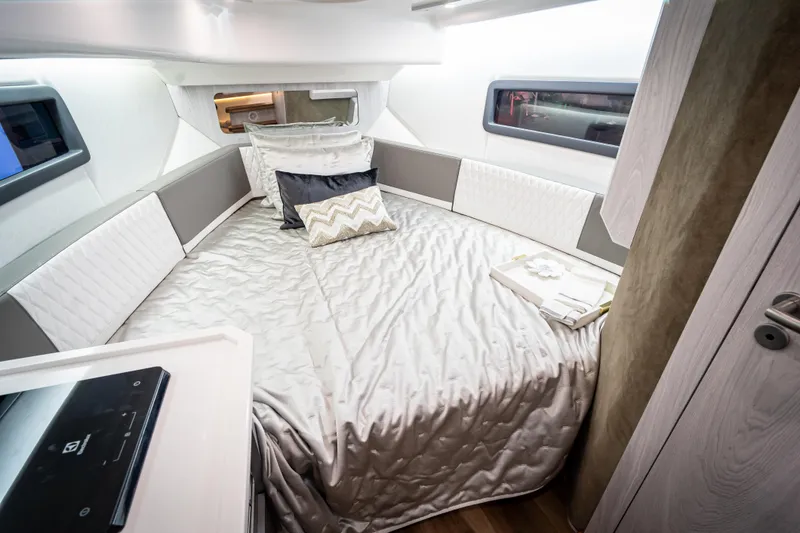 Slide: The Image of Luxurious interior of 2026 Hanover 347 RV with elegant bedding and modern design. - 14