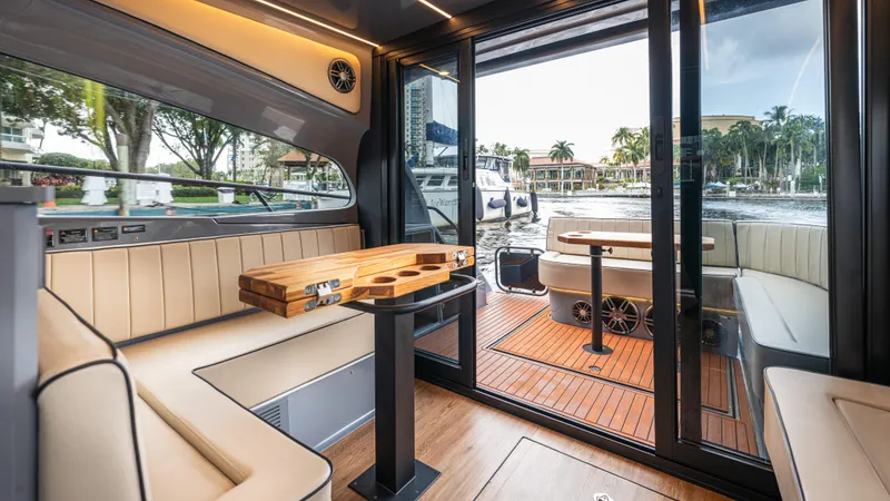 Slide: The Image of Luxurious interior of 2025 Hanover 415 yacht with elegant seating and wooden table. - 16