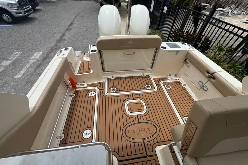 Slide: The Image of 2022 Scout 277 Dorado boat interior with teak flooring and seating. - 22