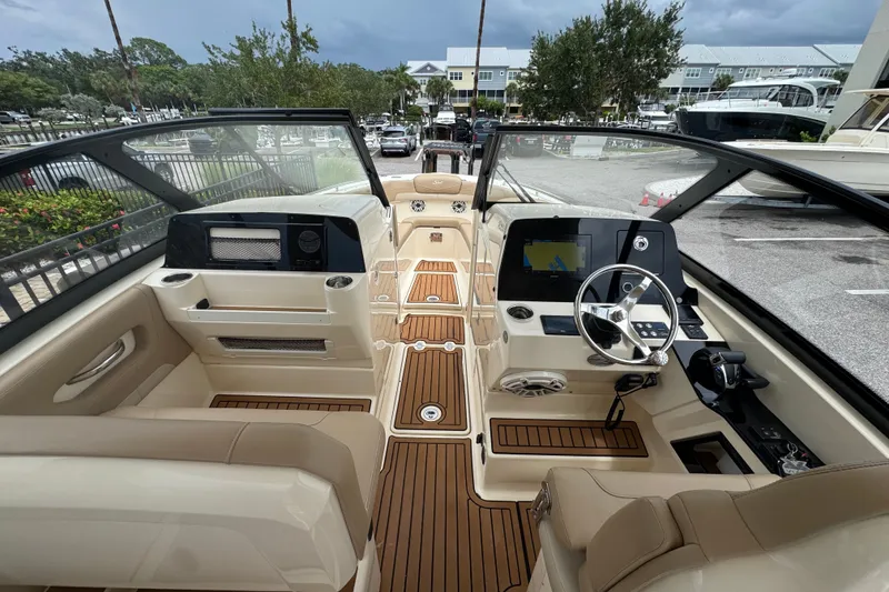 Slide: The Image of 2022 Scout 277 Dorado boat interior with modern dashboard and seating. - 16