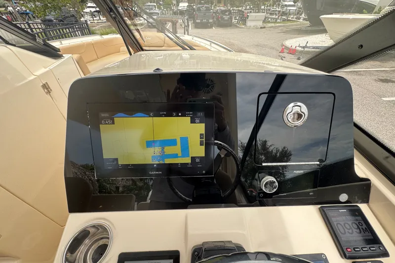 Slide: The Image of 2022 Scout 277 Dorado dashboard with Garmin navigation display and controls. - 26