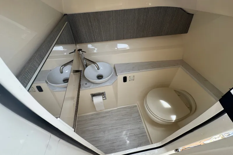 Slide: The Image of 2022 Scout 277 Dorado boat bathroom with modern sink and toilet design. - 34