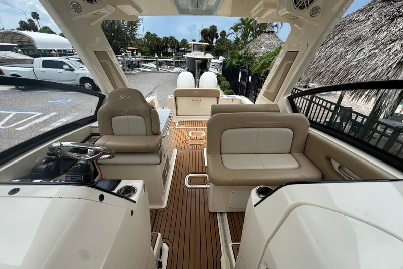 Slide: The Image of 2022 Scout 277 Dorado boat interior with luxurious seating and modern design. - 17