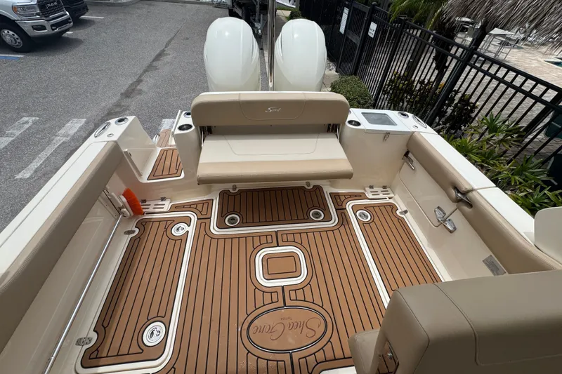 Slide: The Image of 2022 Scout 277 Dorado boat interior with teak flooring and seating. - 23