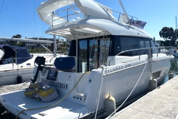 The Image of 2016 Jeanneau Velasco 37F yacht docked at marina, rear view. - 0