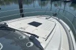 Slide: The Image of 2016 Jeanneau Velasco 37F yacht deck with railing, docked in marina. - 16