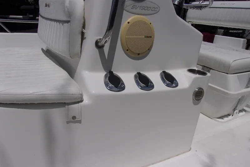 Slide: The Image of 2004 Sea Pro SV1900CC Bay Boat console with speaker and cup holders. - 11