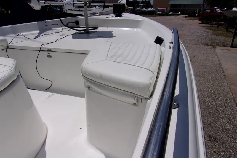 Slide: The Image of 2004 Sea Pro SV1900CC Bay Boat interior with white seating and railing. - 9