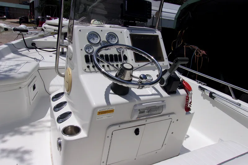 Slide: The Image of 2004 Sea Pro SV1900CC Bay Boat cockpit with steering wheel and gauges. - 5