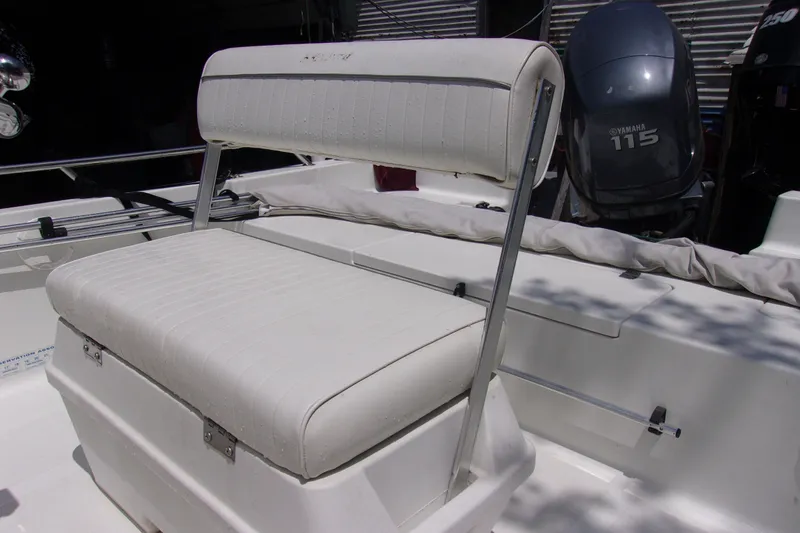 Slide: The Image of 2004 Sea Pro SV1900CC Bay Boat with Yamaha 115 engine and cushioned seating. - 6