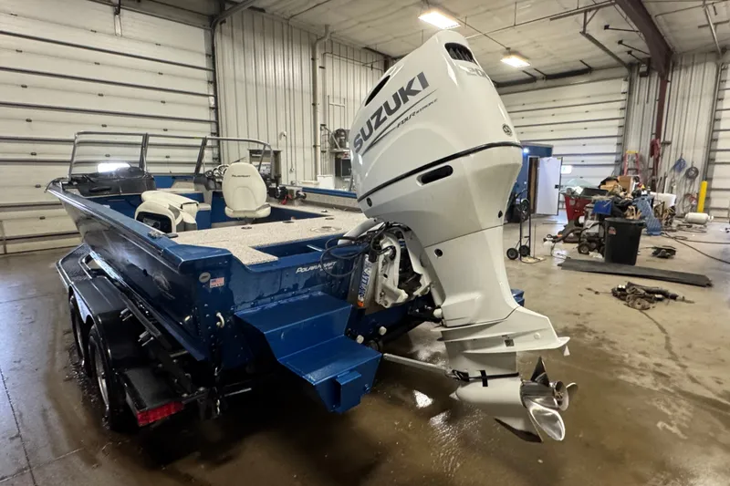 Slide: The Image of Polar Kraft Outlander 2010 WT boat with Suzuki engine in a garage, 2023 model. - 4