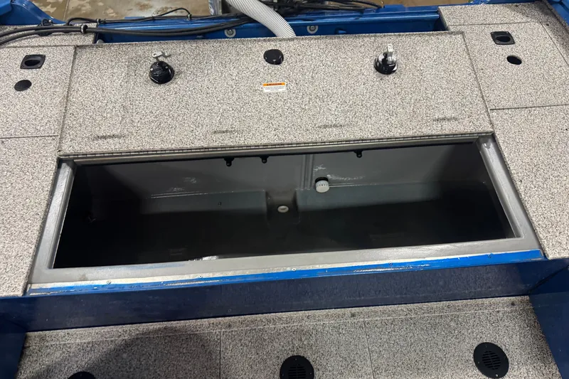 Slide: The Image of Open storage compartment on a 2023 Polar Kraft Outlander 2010 WT boat. - 10
