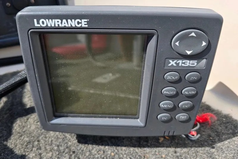 Slide: The Image of Lowrance X135 fish finder on 1997 Cajun 1700 Fish and Ski boat dashboard. - 9