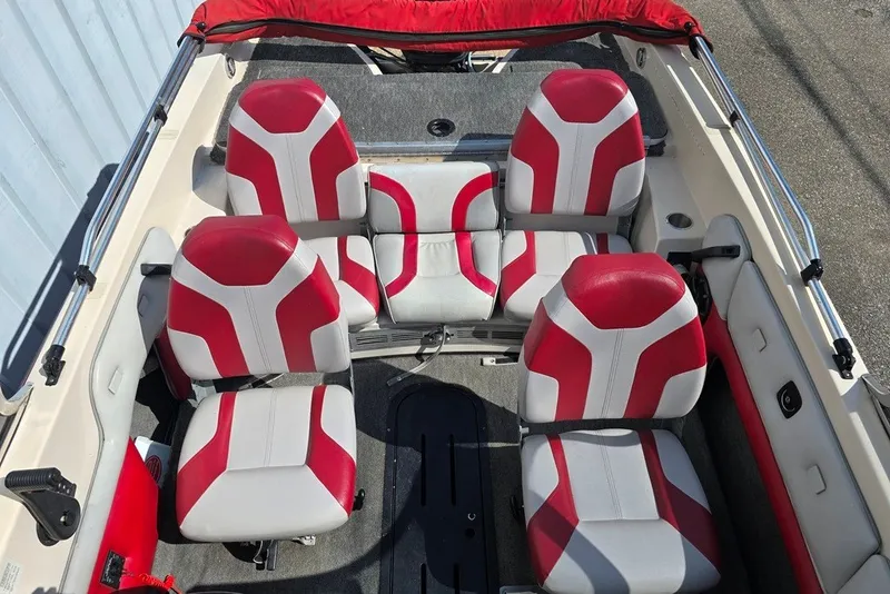 Slide: The Image of 1997 Cajun 1700 Fish and Ski boat interior with red and white seating arrangement. - 4
