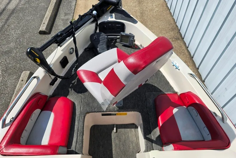 Slide: The Image of 1997 Cajun 1700 Fish and Ski boat interior with red and white seating. - 7