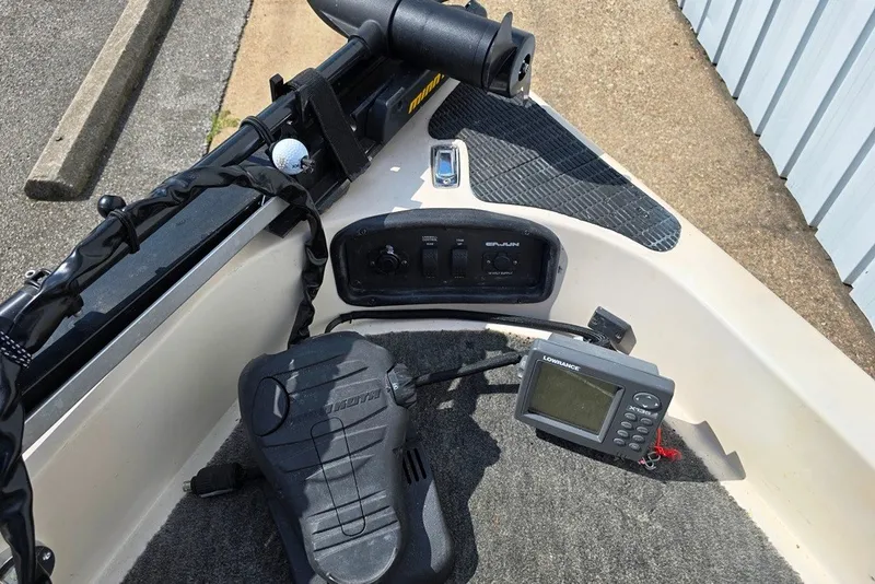 Slide: The Image of 1997 Cajun 1700 Fish and Ski boat dashboard with Lowrance fish finder and Minn Kota foot pedal. - 8