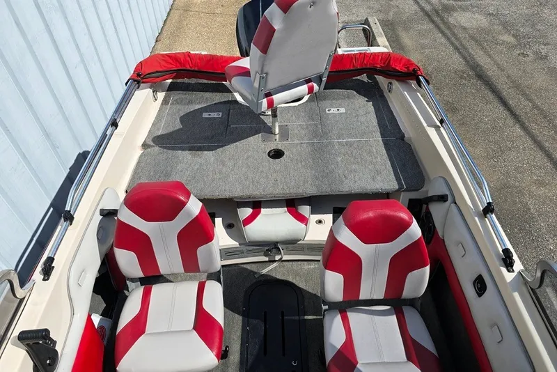 Slide: The Image of 1997 Cajun 1700 Fish and Ski boat interior with red and white seating. - 5