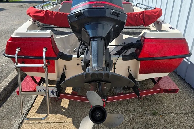 Slide: The Image of 1997 Cajun 1700 Fish and Ski boat with Johnson outboard motor, red and white design. - 11