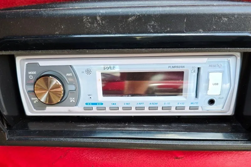 Slide: The Image of Pyle stereo system in a 1997 Cajun 1700 Fish and Ski boat dashboard. - 18
