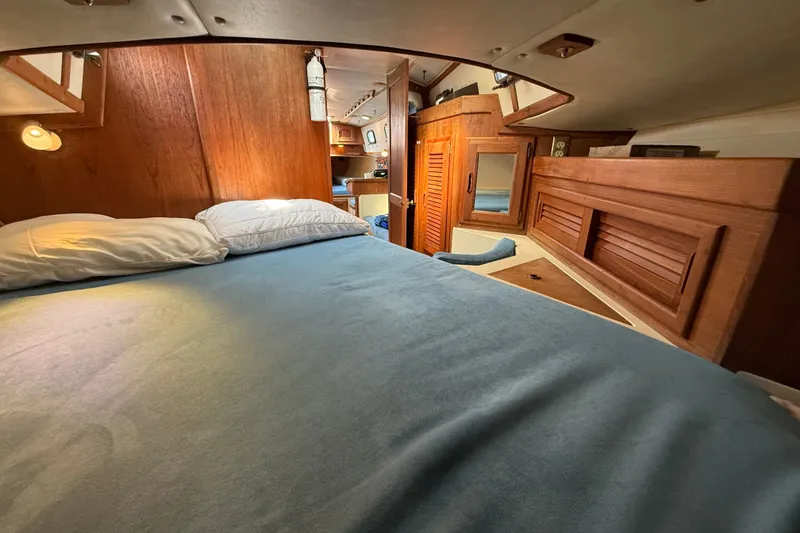 Slide: The Image of Cozy cabin interior of 1994 Pacific Seacraft Crealock 37 sailboat with wooden furnishings. - 40