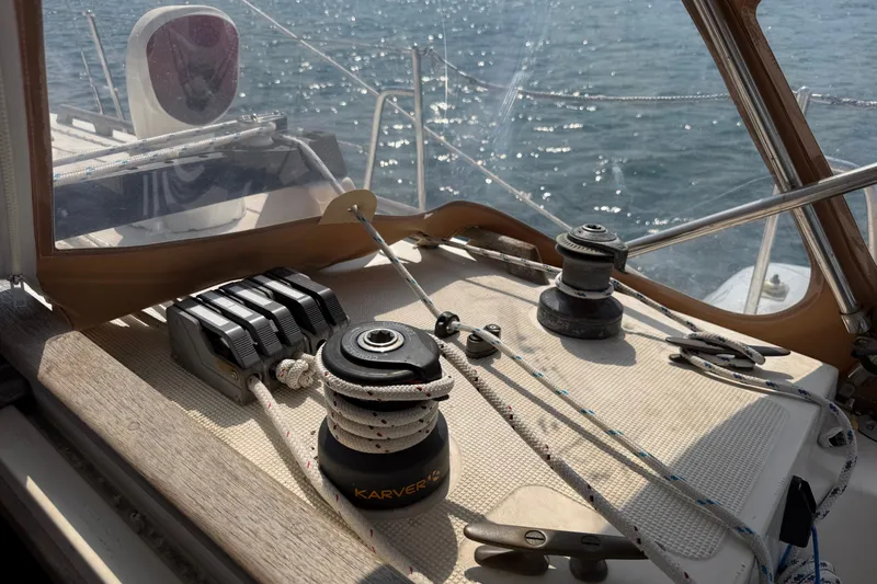 Slide: The Image of Cockpit of 1994 Pacific Seacraft Crealock 37 sailboat with winches and ropes. - 69