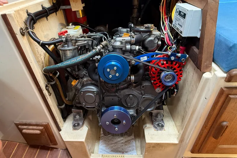 Slide: The Image of Engine compartment of a 1994 Pacific Seacraft Crealock 37 sailboat, showcasing mechanical components. - 78