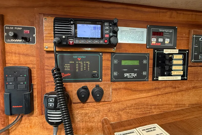 Slide: The Image of Control panel of a 1994 Pacific Seacraft Crealock 37 sailboat with navigation and communication equipment. - 24