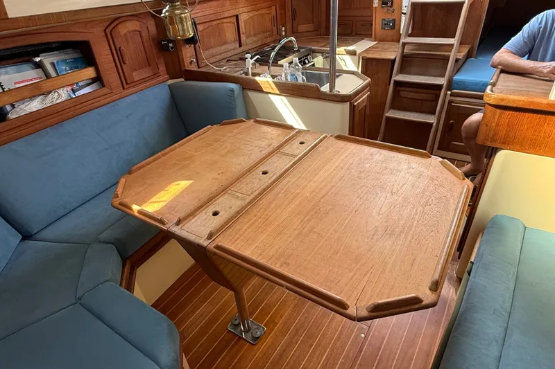 Slide: The Image of Interior of 1994 Pacific Seacraft Crealock 37 sailboat with wooden table and seating. - 20