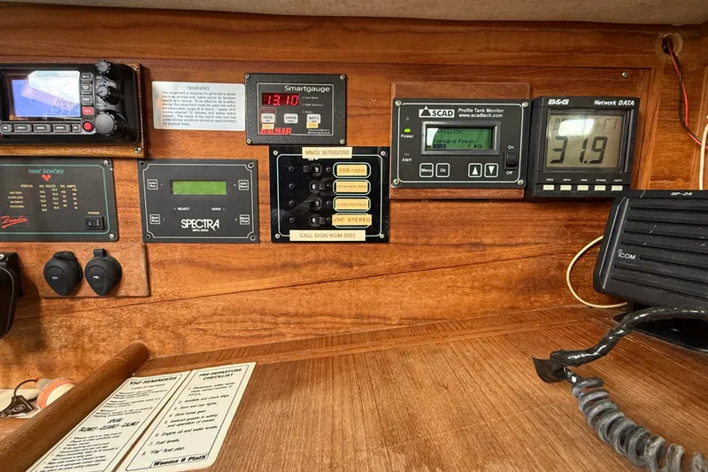 Slide: The Image of Control panel of a 1994 Pacific Seacraft Crealock 37 sailboat with various navigation instruments. - 22