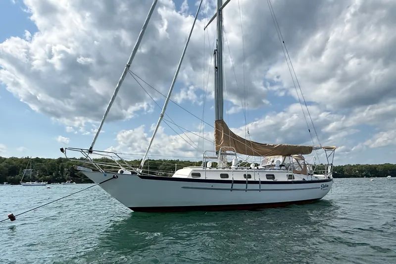 Slide: The Image of Sailboat Pacific Seacraft Crealock 37, 1994 model, anchored on a sunny day. - 7
