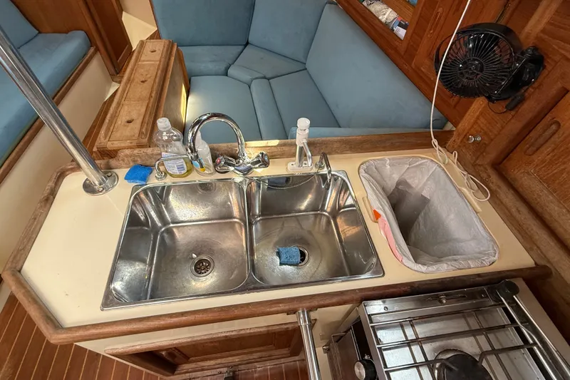 Slide: The Image of Galley sink and seating area in 1994 Pacific Seacraft Crealock 37 yacht interior. - 37