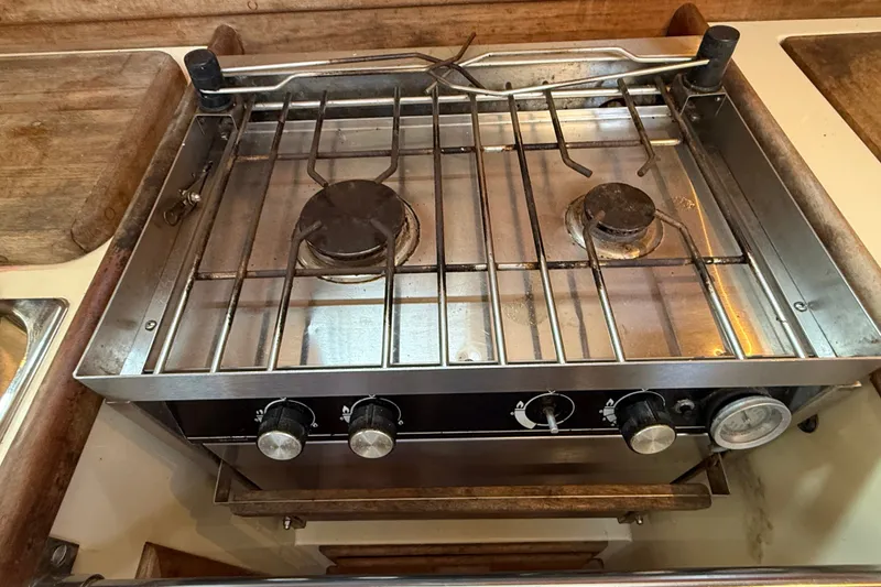 Slide: The Image of Stainless steel stove in 1994 Pacific Seacraft Crealock 37 yacht galley. - 30