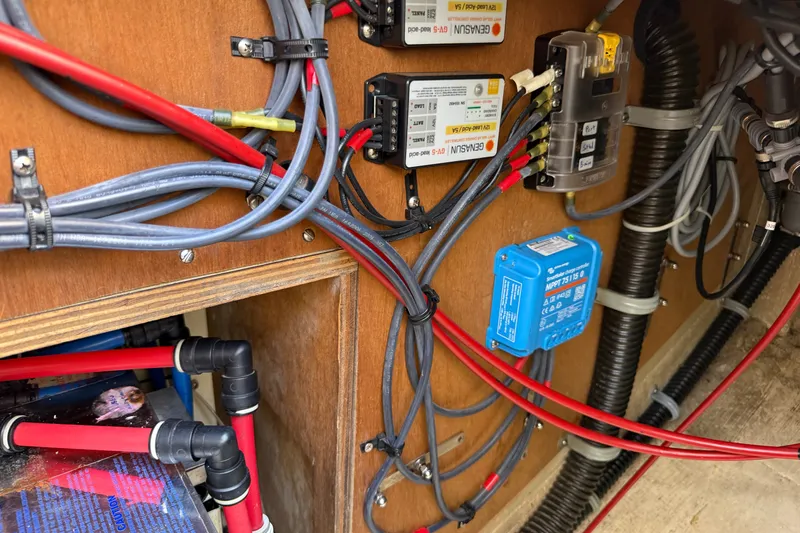 Slide: The Image of Electrical wiring and components inside a 1994 Pacific Seacraft Crealock 37 sailboat. - 83