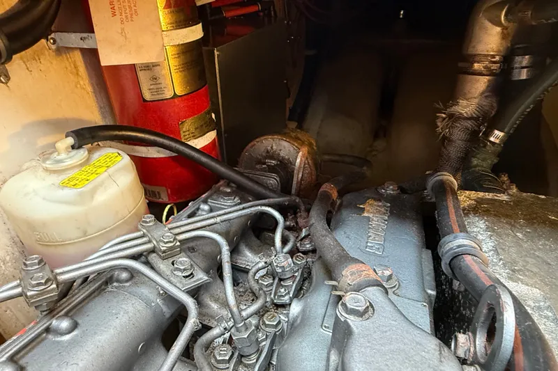 Slide: The Image of Engine compartment of a 1994 Pacific Seacraft Crealock 37 sailboat, featuring mechanical components. - 80