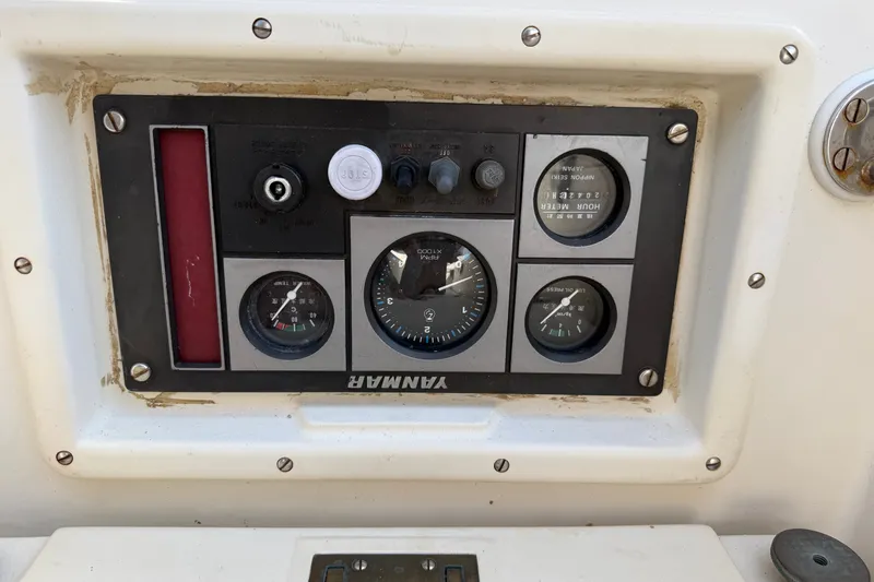 Slide: The Image of Control panel of a 1994 Pacific Seacraft Crealock 37 sailboat with gauges and switches. - 77