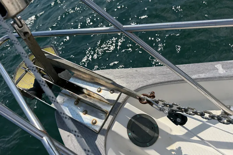 Slide: The Image of Bow of 1994 Pacific Seacraft Crealock 37 with anchor and chain in sunlight. - 56